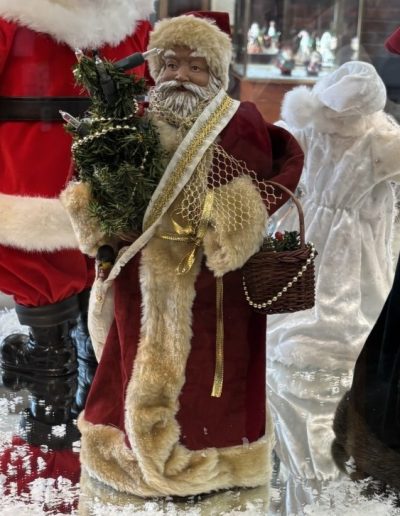 A Santa Claus figurine is prominently displayed in a glass case, capturing the festive spirit of the holiday season.